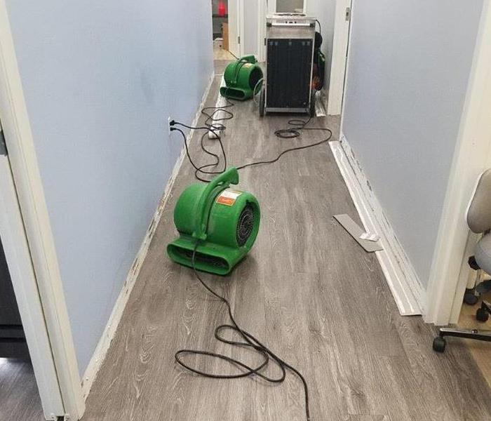 Air movers on floor in an office.