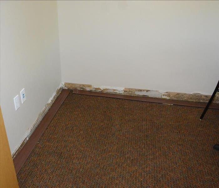 Baseboards removed from wall.